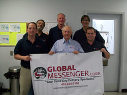 global messenger founders holding banner